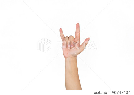 Asian Thai males raise up his hand and showing the Sign of love on the white background. Asian Thai males raise up his hand and showing the Sign of love on the white background. 90747484