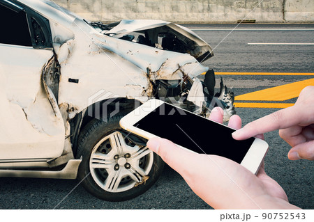 Driver using mobile smartphone with car crash accident on the road 90752543