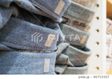 Fashion shirts on shelf in clothing store 90753507