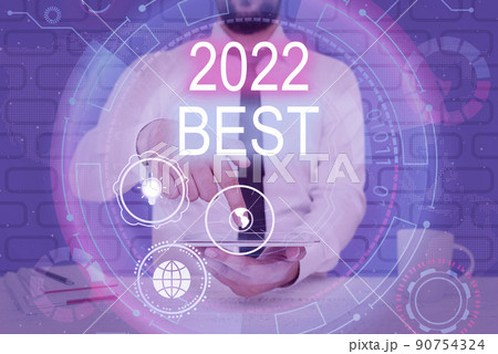 Hand writing sign 2022 Best. Word Written on Highest quality done in all fields preparing for the next year Businessman pointing down tablet represents global innovative thinking. 90754324