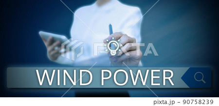 Hand writing sign Wind Power. Business showcase use of air flowto provide mechanical power to turn generators Businessman in suit holding open palm symbolizing successful teamwork. Hand writing sign Wind Power. Business showcase use of air flowto provide mechanical power to turn generators Businessman in suit holding open palm symbolizing successful teamwork. 90758239