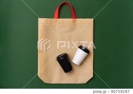 Textile shopping bag and coffee cup flat lay 90759287