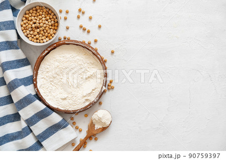 Chickpea and flour in ceramic bowl on white background Chickpea and flour in ceramic bowl on white background 90759397