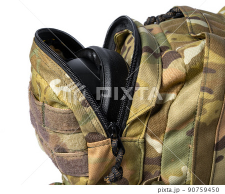 Open military backpack of khaki color on a white background 90759450