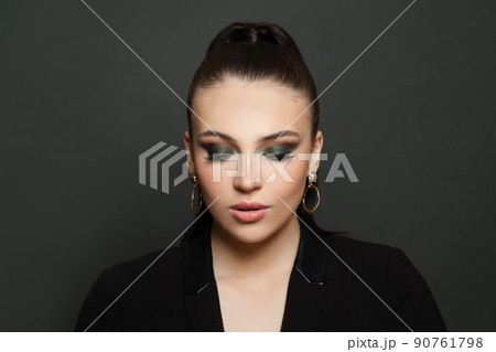 Beautiful fashion model woman face with dark green smokey eyes makeup closeup portrait 90761798