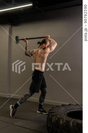 Tire muscular hammer crossfit wheel sledge man hitting gym athlete, concept strength heavy from strong from bodybuilder hit, health physical. Dark strike rest, 90762590