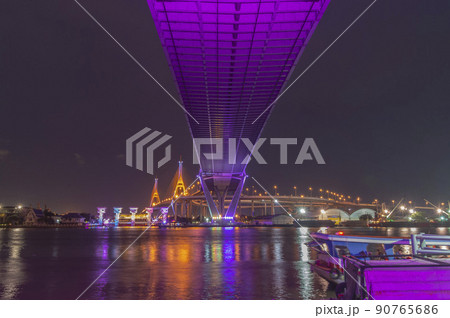 Bhumibol Bridge, Chao Phraya River Bridge. Turn on the lights in many colors at night. 90765686