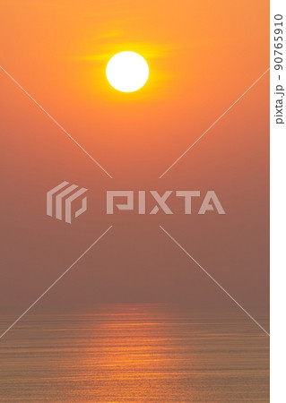 Sunset, the sea surface, reflecting the sun in orange. Clear sky, cloudless orange Sunset, the sea surface, reflecting the sun in orange. Clear sky, cloudless orange 90765910