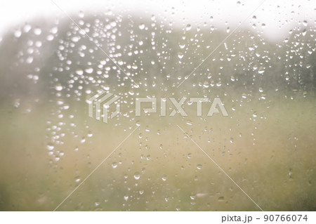 Natural pattern of rain drops on window glass surface. Natural pattern of rain drops on window glass surface. 90766074