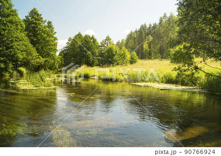 Year landscape with stream on background sky Year landscape with stream on background sky 90766924