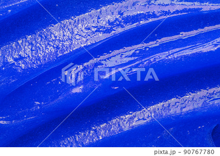 Blue gel texture. Cosmetic clear liquid cream smudge. Skin care product sample closeup. Toothpaste or wax Blue gel texture. Cosmetic clear liquid cream smudge. Skin care product sample closeup. Toothpaste or wax 90767780