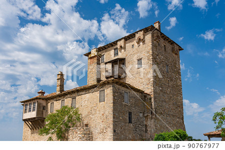 Byzantine Prosphorion tower in Greece against the background of clouds and blue sky 90767977