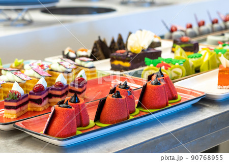 Beautiful and bright photo of pastries and cakes on the bar counter in the hotel Beautiful and bright photo of pastries and cakes on the bar counter in the hotel 90768955