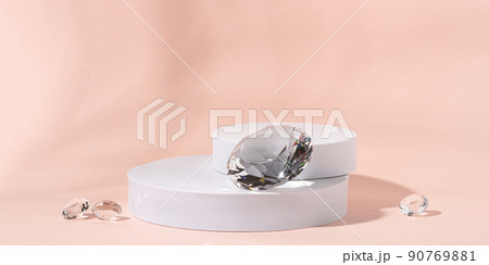 White podium with diamonds on a pink background for product presentation. Minimal concept and hard sunlight. White podium with diamonds on a pink background for product presentation. Minimal concept and hard sunlight. 90769881