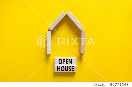 Open house symbol. Concept words 'Open house' on wooden blocks near miniature house. Beautiful yellow background, copy space. Business and open house concept. Open house symbol. Concept words 'Open house' on wooden blocks near miniature house. Beautiful yellow background, copy space. Business and open house concept. 90771543