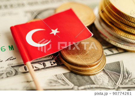 Stack of coins with Turkey flag on USA America dollar banknotes. Stack of coins with Turkey flag on USA America dollar banknotes. 90774261