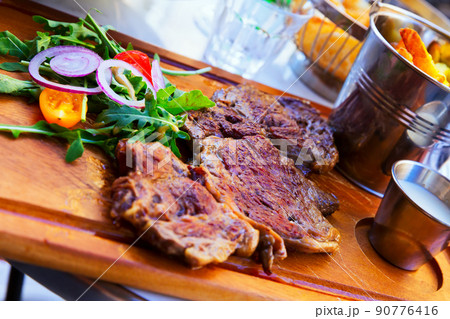 Delicious roasted beef 90776416