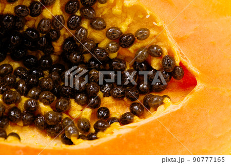 Close up of of ripe papaya. View of the Inside of a Papaya. Sweet tropical fruit 90777165