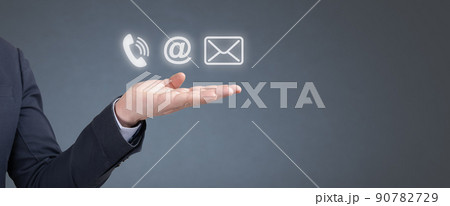 CONTACT US Methods. Hand businessman hold Phone, Email and Post Icons. Customer Support Hotline people CONNECT. Business man showing to contact us online. banner copy space 90782729