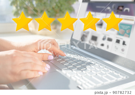five star rating. Rise on increasing five stars in human hand, Increase rating evaluation classification concept. Woman hand using laptop with icon five star symbol to increase rating company concept 90782732