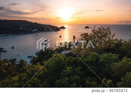 The sun rises in the morning at the sea on the island. 90783872