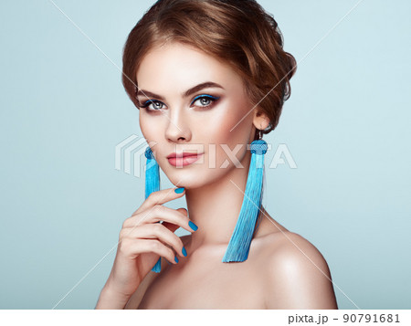 Beautiful Woman with Large Earrings Tassels Beautiful Woman with Large Earrings Tassels 90791681