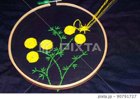 woolen handicraft work with circle frame on cloth 90791727