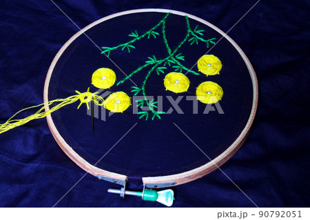 woolen handicraft work with circle frame on cloth 90792051