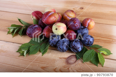 Plums on table 90793870