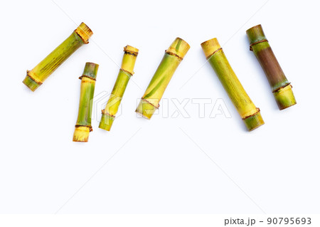 Sugar cane on white background. Sugar cane on white background. 90795693