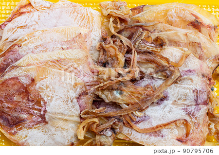 Dried squid on yellow background. 90795706