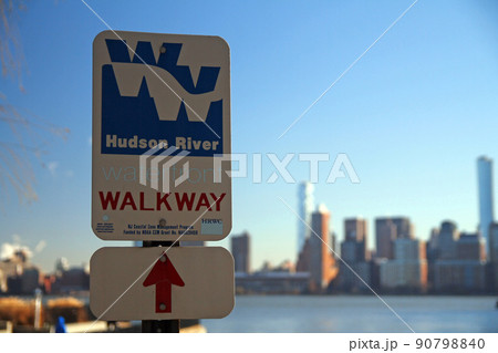 Hudson River Waterfront Walkway sign with red arrow on the river Hudson River Waterfront Walkway sign with red arrow on the river 90798840