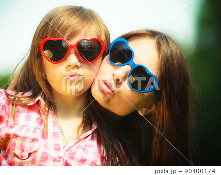 Summer. Mother and kid in sunglasses making funny faces 90800174