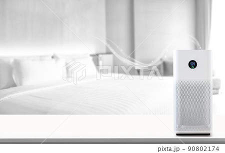air purifier a living room,  air cleaner removing fine dust in house. protect PM 2.5 dust and air pollution concept 90802174
