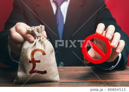 Man refuses to give out british pound sterling money bag. Financial difficulties. Economic sanctions, confiscation of funds. Refusal to provide a loan, bad credit history. Asset freeze seizure. 90804513