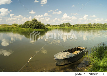 Boat beside coast on background blue sky 90804594