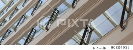 Facade of multistorey building with glass balconies closeup background 90804955