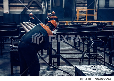Worker at Steel Factory or Pipe Mill located in Taganrog South of Russia 90805598