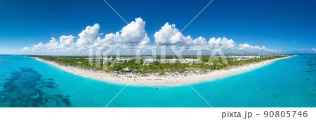 Bounty coastline with resorts, palm trees, caribbean sea and people having fun on beach. Dominican Republic. Aerial panorama view 90805746