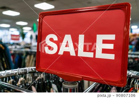 Sale Sign On Rail in Clothes Shop 90807106
