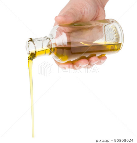 Oil pouring from a bottle. Oil pouring from a bottle. 90808024