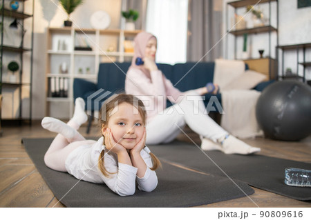 Morning sports and health gymnastics at home. 90809616
