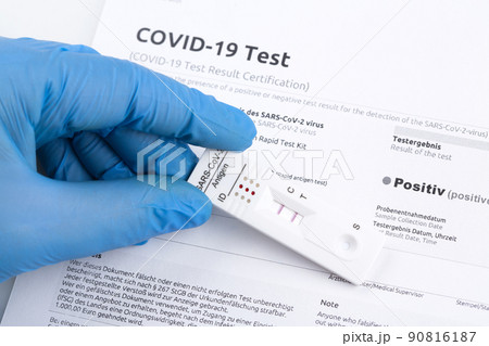Positive test result by using rapid test device for COVID-19. 90816187