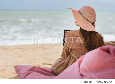 Woman relax from working at the beach in holidays Woman relax from working at the beach in holidays 90826572