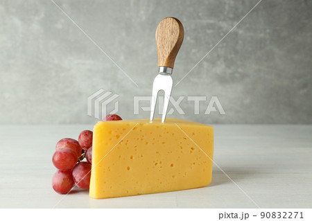 Concept of cooking eating with hard cheese on white wooden table Concept of cooking eating with hard cheese on white wooden table 90832271