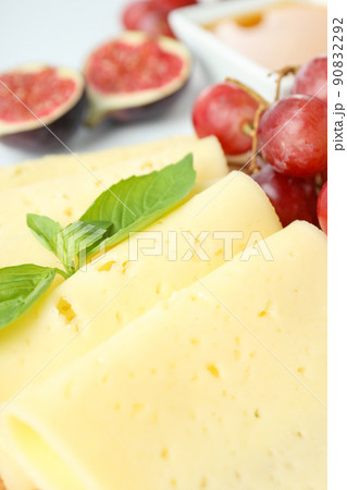 Concept of cooking eating with hard cheese, close up Concept of cooking eating with hard cheese, close up 90832292