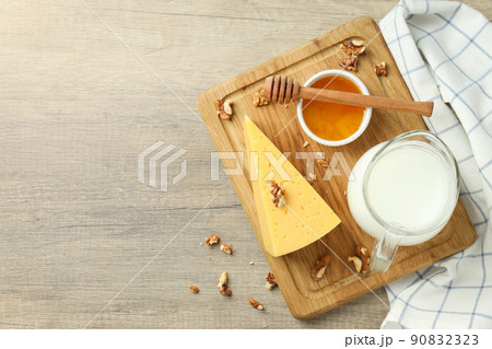 Concept of cooking eating with hard cheese on wooden background Concept of cooking eating with hard cheese on wooden background 90832323