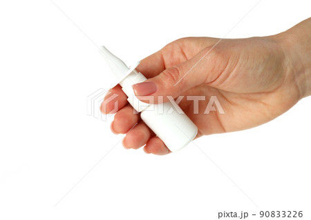 Female hand holds blank bottle of nasal spray, isolated on white background 90833226
