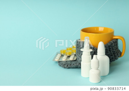 Flu treatment accessories on blue background, space for text Flu treatment accessories on blue background, space for text 90833714