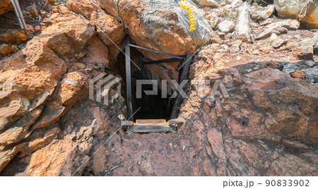 Natural stalactite and stalagmite rock stone cliff hang from cave ceiling in cave. Environmental explore. Landscape background. Erosion 90833902